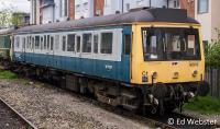 Class 121 single car DMU in BR green with full yellow ends