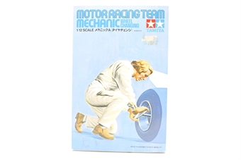 Motor racing team mechanic (wheel changing)
