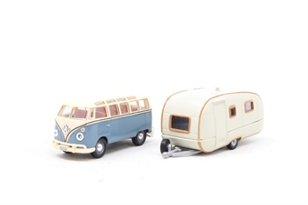VW samba bus in light blue with caravan