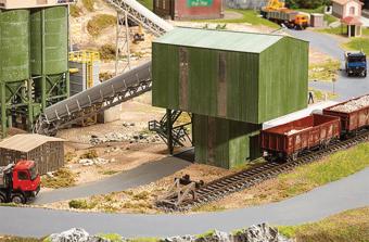 Feeding tower for stone-breaking works kit