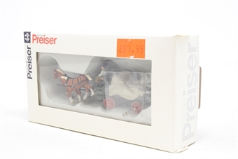 Horse drawn wagon with tarpaulin