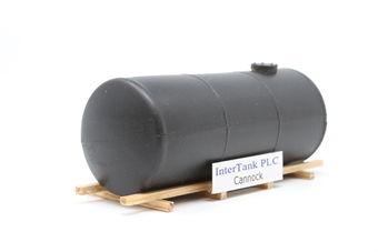 Black tank on wood chock