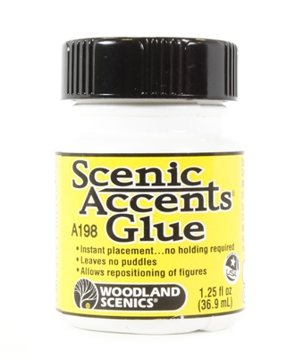 Scenic Accents glue. Stays tacky - prevents snapping of figures