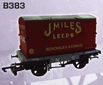 Conflat wagon in North Eastern grey with container "J. Miles"
