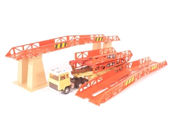 Bridge laying truck