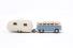 VW samba bus in light blue with caravan