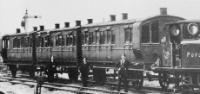 A train of 4-wheel caoches led by a Class A1 Terrier. ©Dave Searle Collection
